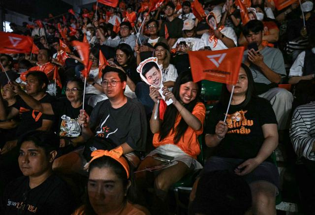 Supporters cheer during a People's Party campaign rally ahead of the general election in Bangkok on February 6, 2026. (Photo by Lillian SUWANRUMPHA / AFP)