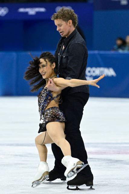 USA's Madison Chock (L) and USA's Evan Bates compete in the figure skating team event ice dance-rhythm dance during the Milano Cortina 2026 Winter Olympic Games at Milano Ice Skating Arena in Milan on February 6, 2026. (Photo by WANG Zhao / AFP)