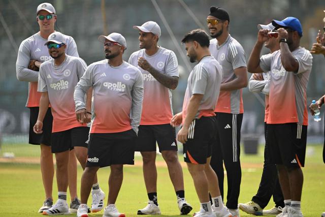 India's captain Suryakumar Yadav (C) interacts with his teammates during training session on the eve of the 2026 ICC Men's T20 Cricket World Cup match against United States, at the Wankhede Stadium in Mumbai on February 6, 2026. India captain Suryakumar Yadav admitted on February 6 "there will be nerves" when India open their T20 World Cup campaign in front of more than 30,000 fanatical home supporters in Mumbai, but vowed to give them "entertainment". (Photo by Punit PARANJPE / AFP)