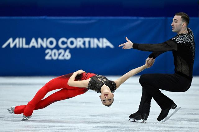 Georgia's Anastasiia Metelkina and Luka Berulava compete in the figure skating pair short program during the Milano Cortina 2026 Winter Olympic Games at Milano Ice Skating Arena in Milan on February 6, 2026. (Photo by WANG Zhao / AFP)