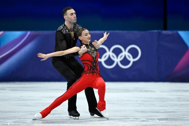 Georgia's Anastasiia Metelkina and Luka Berulava compete in the figure skating pair short program during the Milano Cortina 2026 Winter Olympic Games at Milano Ice Skating Arena in Milan on February 6, 2026. (Photo by WANG Zhao / AFP)