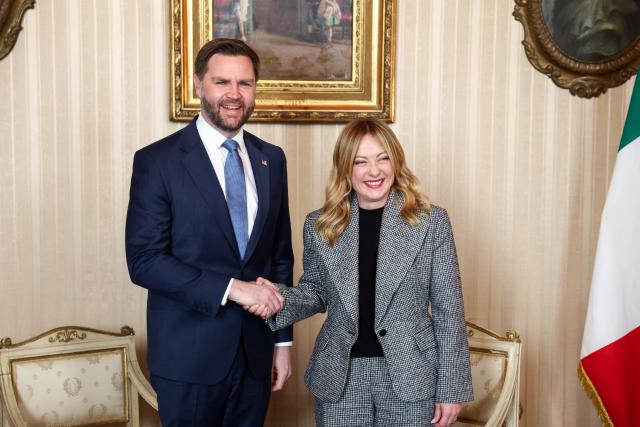 U.S. Vice President JD Vance (L) is welcomed by Italian Prime Minister Giorgia Meloni (R) ahead of their meeting as part of his visit to the Milano Cortina 2026 Winter Olympics in Milan on February 6, 2026. (Photo by Kevin Lamarque / POOL / AFP)