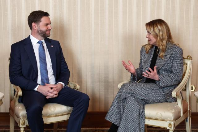 U.S. Vice President JD Vance (L) speaks with Italian Prime Minister Giorgia Meloni (R) ahead of their meeting as part of his visit to the Milano Cortina 2026 Winter Olympics in Milan on February 6, 2026. (Photo by Kevin Lamarque / POOL / AFP)