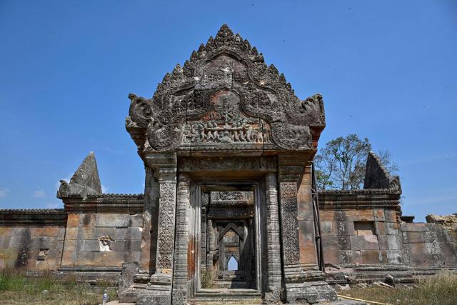 This photo shows part of the Preah Vihear temple in Preah Vihear province on February 6, 2026. Chunks of broken sandstone litter Cambodia's UNESCO-listed Preah Vihear temple, whose centuries-old sandstone facades are pocked with fresh shrapnel scars after weeks of deadly border clashes with neighbouring Thailand. Considered a masterpiece of Khmer architecture that looks out over the northern Cambodian plains, the temple became a war zone when a longstanding border dispute erupted into fighting with jets, artillery, tanks and ground troops last year. (Photo by TANG CHHIN Sothy / AFP) / To go with 'CAMBODIA-THAILAND-CONFLICT-HERITAGE, REPORTAGE' by Suy SE