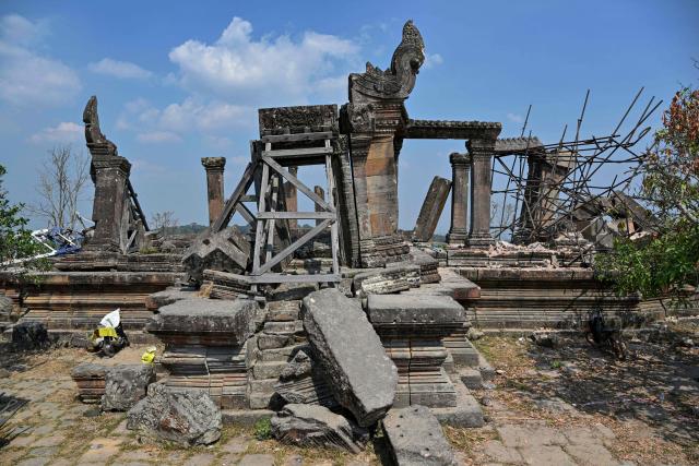 Damaged structures are seen at the Preah Vihear temple in Preah Vihear province on February 6, 2026. Chunks of broken sandstone litter Cambodia's UNESCO-listed Preah Vihear temple, whose centuries-old sandstone facades are pocked with fresh shrapnel scars after weeks of deadly border clashes with neighbouring Thailand. Considered a masterpiece of Khmer architecture that looks out over the northern Cambodian plains, the temple became a war zone when a longstanding border dispute erupted into fighting with jets, artillery, tanks and ground troops last year. (Photo by TANG CHHIN Sothy / AFP) / To go with 'CAMBODIA-THAILAND-CONFLICT-HERITAGE, REPORTAGE' by Suy SE
