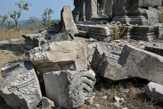 A damaged structure is seen at the Preah Vihear temple in Preah Vihear province on February 6, 2026. Chunks of broken sandstone litter Cambodia's UNESCO-listed Preah Vihear temple, whose centuries-old sandstone facades are pocked with fresh shrapnel scars after weeks of deadly border clashes with neighbouring Thailand. Considered a masterpiece of Khmer architecture that looks out over the northern Cambodian plains, the temple became a war zone when a longstanding border dispute erupted into fighting with jets, artillery, tanks and ground troops last year. (Photo by TANG CHHIN Sothy / AFP) / To go with 'CAMBODIA-THAILAND-CONFLICT-HERITAGE, REPORTAGE' by Suy SE