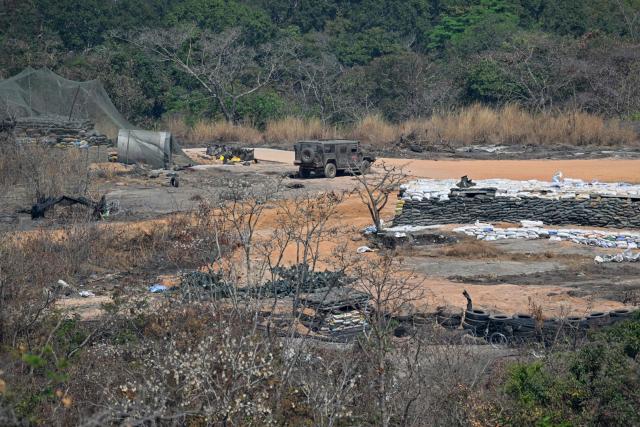 Thai bunkers are seen in front of the Preah Vihear temple in Preah Vihear province on February 6, 2026. Chunks of broken sandstone litter Cambodia's UNESCO-listed Preah Vihear temple, whose centuries-old sandstone facades are pocked with fresh shrapnel scars after weeks of deadly border clashes with neighbouring Thailand. Considered a masterpiece of Khmer architecture that looks out over the northern Cambodian plains, the temple became a war zone when a longstanding border dispute erupted into fighting with jets, artillery, tanks and ground troops last year. (Photo by TANG CHHIN Sothy / AFP) / To go with 'CAMBODIA-THAILAND-CONFLICT-HERITAGE, REPORTAGE' by Suy SE