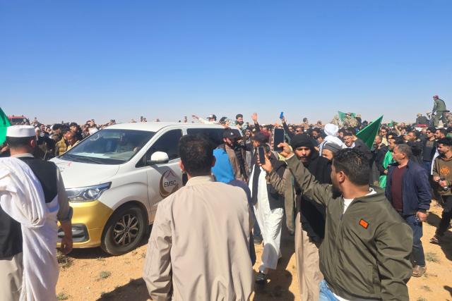 Libyans gather for the funeral of Seif al-Islam Gaddafi, the son of Libya's late longtime ruler, in Bani Walid, in the Tripoli region, western Libya on February 6, 2026. Seif al-Islam, 53, the son of Libya's late longtime ruler, had been seen by some as his father's successor, despite being targeted by a warrant from the International Criminal Court for alleged crimes against humanity. He was killed on February 3, 2026, by gunmen who stormed his home in western Libya's Zintan, his French lawyer told AFP. (Photo by Mahmud Turkia / AFP)