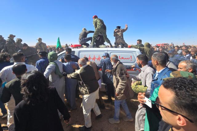 Libyans gather for the funeral of Seif al-Islam Gaddafi, the son of Libya's late longtime ruler, in Bani Walid, in the Tripoli region, western Libya on February 6, 2026. Seif al-Islam, 53, the son of Libya's late longtime ruler, had been seen by some as his father's successor, despite being targeted by a warrant from the International Criminal Court for alleged crimes against humanity. He was killed on February 3, 2026, by gunmen who stormed his home in western Libya's Zintan, his French lawyer told AFP. (Photo by Mahmud Turkia / AFP)