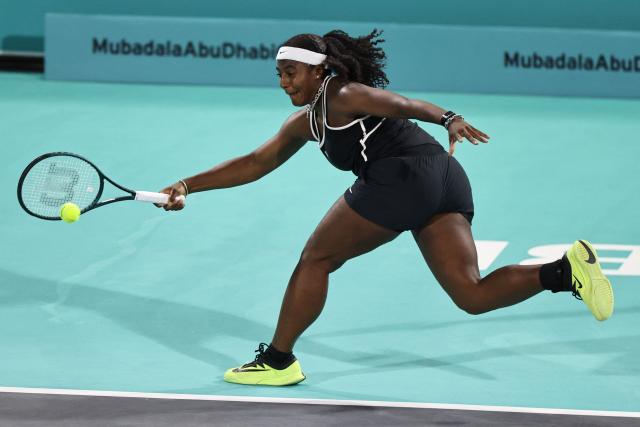 USA's Hailey Baptiste hits a return against Russia’s Ekaterina Alexandrova during their women’s singles semi-final match at the Abu Dhabi Open tennis tournament in Abu Dhabi on February 6, 2026. (Photo by Fadel SENNA / AFP)