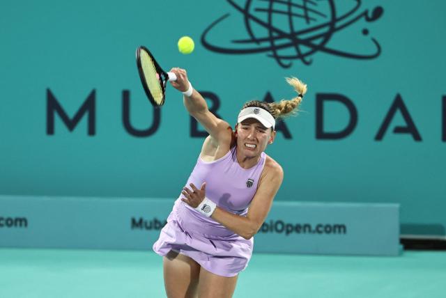 Russia’s Ekaterina Alexandrova serves against USA's Hailey Baptiste during their women’s singles semi-final match at the Abu Dhabi Open tennis tournament in Abu Dhabi on February 6, 2026. (Photo by Fadel SENNA / AFP)