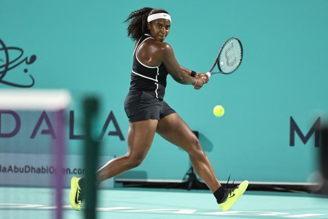 USA's Hailey Baptiste hits a return against Russia’s Ekaterina Alexandrova during their women’s singles semi-final match at the Abu Dhabi Open tennis tournament in Abu Dhabi on February 6, 2026. (Photo by Fadel SENNA / AFP)
