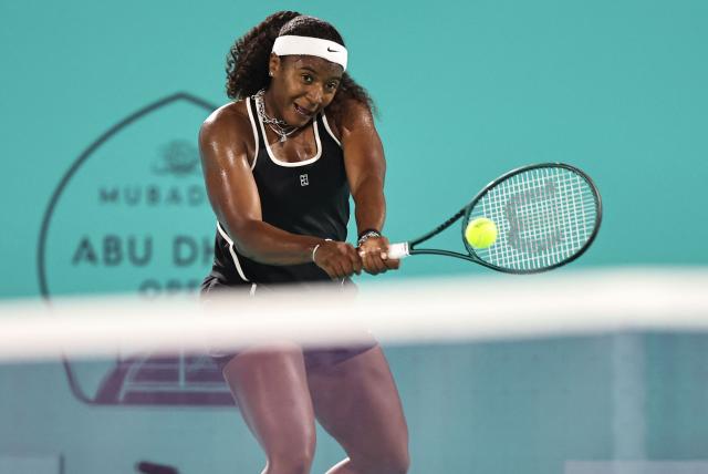USA's Hailey Baptiste hits a return against Russia’s Ekaterina Alexandrova during their women’s singles semi-final match at the Abu Dhabi Open tennis tournament in Abu Dhabi on February 6, 2026. (Photo by Fadel SENNA / AFP)
