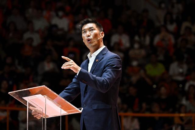 People's Party campaign assistant and former leader of the Future Forward Party Thanathorn Juangroongruangkit speaks on stage during a campaign rally in Bangkok on February 6, 2026, ahead of the country's general election on February 8. (Photo by Lillian SUWANRUMPHA / AFP)