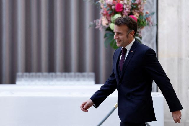 France's President Emmanuel Macron arrives to deliver a speech during a meeting with students from the "Prepas Talents du service public" as part of a program that aims to give every young person an opportunity to join the civil service, at the Elysee Palace in Paris on February 6, 2026. (Photo by Benoit Tessier / POOL / AFP)