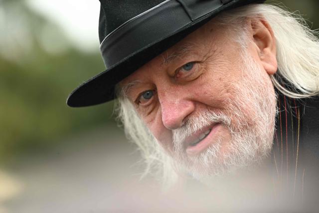 Hungarian writer and winner of the 2025 Nobel Prize in Literature Laszlo Krasznahorkai looks on during the funeral of Hungarian filmmaker Bela Tarr at the Fiumei Road Cemetery of Budapest, Hungary, on February 6, 2026, one month after his death. Legendary Hungarian filmmaker Bela Tarr, known for his long takes, monochromatic movies and depictions of desolate landscapes on the silver screen, died on January 6, 2026 at the age of 70. Tarr was best known for the movie "Satantango (1994), a seven-hour epic about the collapse of communism in Eastern Europe and its material and spiritual decline. (Photo by Attila KISBENEDEK / AFP)