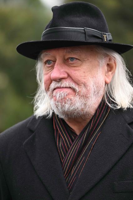 Hungarian writer and winner of the 2025 Nobel Prize in Literature Laszlo Krasznahorkai looks on during the funeral of Hungarian filmmaker Bela Tarr at the Fiumei Road Cemetery of Budapest, Hungary, on February 6, 2026, one month after his death. Legendary Hungarian filmmaker Bela Tarr, known for his long takes, monochromatic movies and depictions of desolate landscapes on the silver screen, died on January 6, 2026 at the age of 70. Tarr was best known for the movie "Satantango (1994), a seven-hour epic about the collapse of communism in Eastern Europe and its material and spiritual decline. (Photo by Attila KISBENEDEK / AFP)