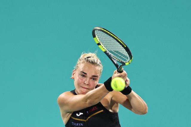 Czech Republic's Sara Bejlek hits a return against Denmark’s Clara Tauson during their women’s singles semi-final match at the Abu Dhabi Open tennis tournament in Abu Dhabi on February 6, 2026. (Photo by Fadel SENNA / AFP)