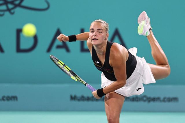 Czech Republic's Sara Bejlek hits a return against Denmark’s Clara Tauson during their women’s singles semi-final match at the Abu Dhabi Open tennis tournament in Abu Dhabi on February 6, 2026. (Photo by Fadel SENNA / AFP)