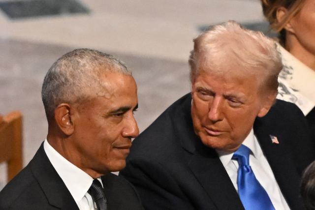(FILES) US President-elect Donald Trump speaks with former President Barack Obama as they attend the State Funeral Service for former US President Jimmy Carter at the Washington National Cathedral in Washington, DC, on January 9, 2025. US President Donald Trump triggered outrage on February 6, 2026, after he posted a video depicting Barack Obama, the first Black president in American history, and his wife Michelle as monkeys. The White House said Friday that the post was made in error by a staff member, and has been removed. (Photo by Mandel NGAN / AFP)