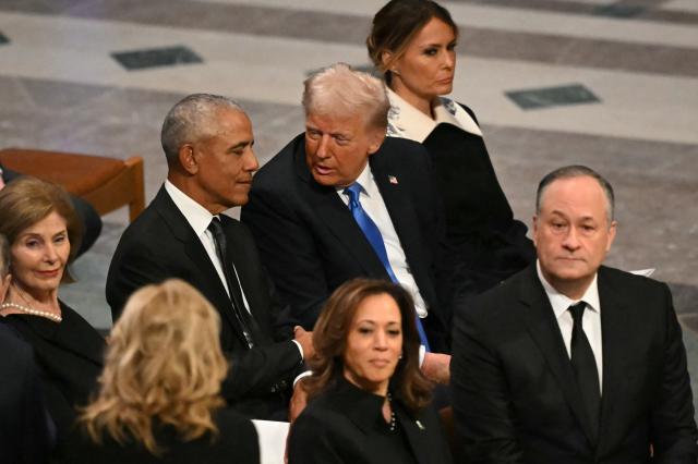 (FILES) US President-elect Donald Trump speaks with former President Barack Obama as they attend the State Funeral Service for former US President Jimmy Carter at the Washington National Cathedral in Washington, DC, on January 9, 2025. US President Donald Trump triggered outrage on February 6, 2026, after he posted a video depicting Barack Obama, the first Black president in American history, and his wife Michelle as monkeys. The White House said Friday that the post was made in error by a staff member, and has been removed. (Photo by Mandel NGAN / AFP)
