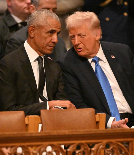 (FILES) Former US President Barack Obama speaks with President-elect Donald Trump before the State Funeral Service for former US President Jimmy Carter at the Washington National Cathedral in Washington, DC, on January 9, 2025. US President Donald Trump triggered outrage on February 6, 2026, after he posted a video depicting Barack Obama, the first Black president in American history, and his wife Michelle as monkeys. The White House said Friday that the post was made in error by a staff member, and has been removed. (Photo by ROBERTO SCHMIDT / AFP)