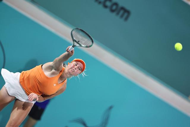 Denmark’s Clara Tauson serves against Czech Republic's Sara Bejlek during their women’s singles semi-final match at the Abu Dhabi Open tennis tournament in Abu Dhabi on February 6, 2026. (Photo by Fadel SENNA / AFP)