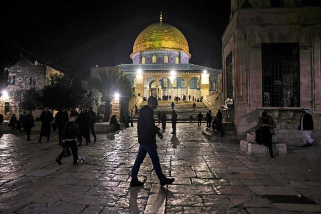 Palestinian Muslim worshippers gather outside the Dome of the Rock Shrine at the Aqsa mosque compound in the old city of Jerusalem late on Febuary 6, 2026. (Photo by AHMAD GHARABLI / AFP)