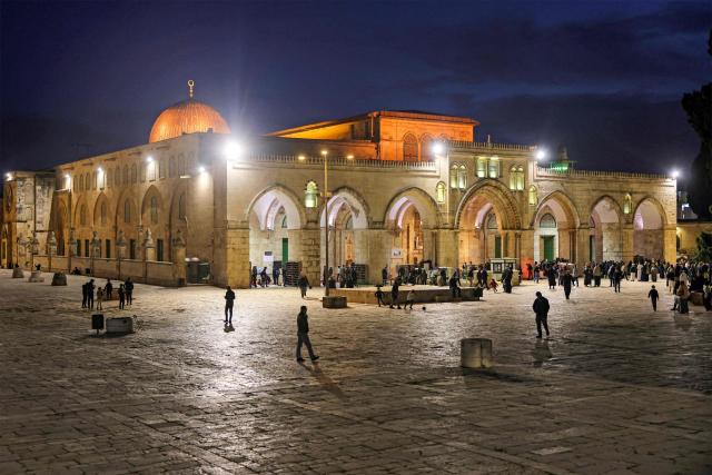 TOPSHOT - Palestinian Muslim worshippers gather outside the Aqsa Mosque, Islam's third holiest site, at the Aqsa mosque compound in the old city of Jerusalem late on Febuary 6, 2026. (Photo by AHMAD GHARABLI / AFP)