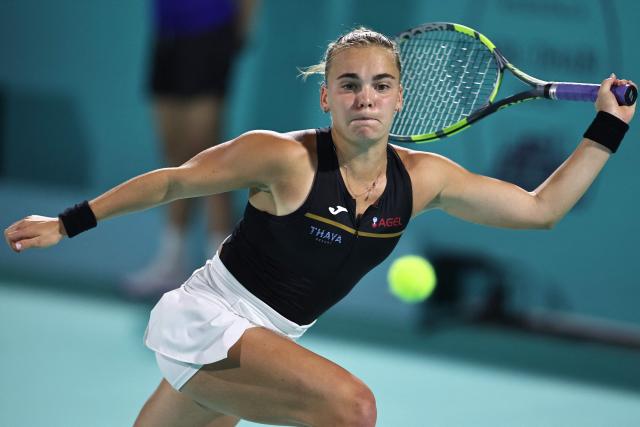 Czech Republic's Sara Bejlek hits a return against Denmark’s Clara Tauson during their women’s singles semi-final match at the Abu Dhabi Open tennis tournament in Abu Dhabi on February 6, 2026. (Photo by Fadel SENNA / AFP)