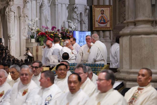 A group of priests wait for the start of an installation Mass for Ronald Hicks to become the 11th Archbishop of New York, succeeding Cardinal Timothy Dolan, at St. Patrick’s Cathedral in New York, on February 6, 2026. (Photo by ANGELA WEISS / AFP)