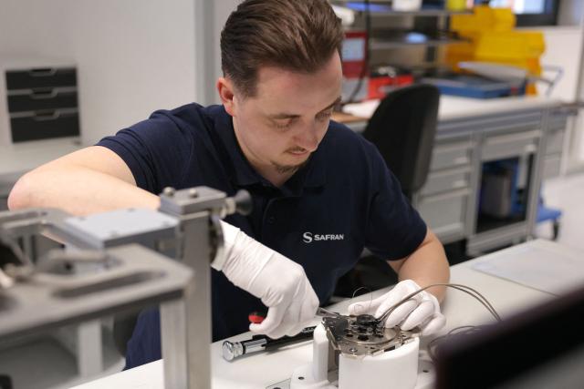 An employee works at the industrial site 'Spacecraft Propulsion' of French multinational aerospace and defence corporation Safran in Vernon on February 6, 2026. (Photo by Thomas SAMSON / AFP)