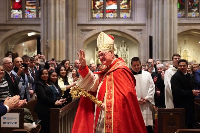 Cardinal Timothy Dolan arrives for an installation Mass for Ronald Hicks to become the 11th Archbishop of New York, succeeding Dolan, at St. Patrick’s Cathedral in New York, on February 6, 2026. (Photo by ANGELA WEISS / AFP)