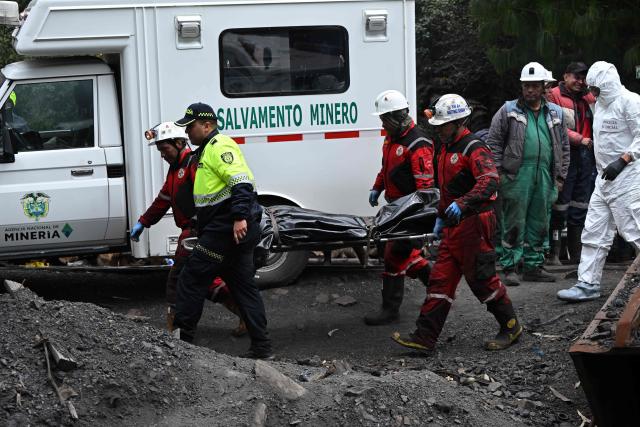 Rescuers carry the body of one of the six miners who were trapped after an explosion at a coal mine in Guacheta, Cundinamarca department, Colombia, on February 6, 2026. (Photo by LUIS ACOSTA / AFP)