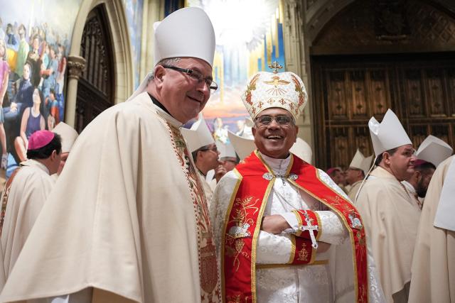 Bishops talk with each other as they gather for the procession during the installation Mass for Ronald Hicks to become the 11th Archbishop of New York, succeeding Dolan, at St. Patrick’s Cathedral in New York, on February 6, 2026. (Photo by Angelina Katsanis / POOL / AFP)