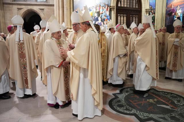 Bishops talk with each other as they gather for the procession during the installation Mass for Ronald Hicks to become the 11th Archbishop of New York, succeeding Dolan, at St. Patrick’s Cathedral in New York, on February 6, 2026. (Photo by Angelina Katsanis / POOL / AFP)