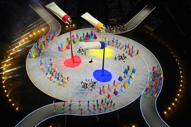 TOPSHOT - Dancers perform during the opening ceremony of the Milano Cortina 2026 Winter Olympic Games at the San Siro stadium in Milan, northern Italy, on February 6, 2026. (Photo by Antonin THUILLIER / AFP)