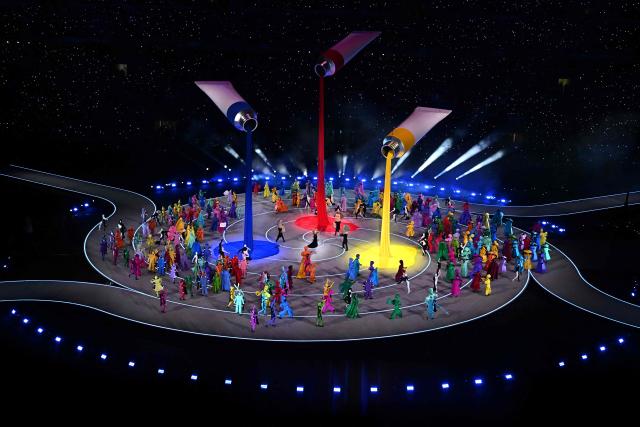 Dancers perform during the opening ceremony of the Milano Cortina 2026 Winter Olympic Games at the San Siro stadium in Milan, northern Italy, on February 6, 2026. (Photo by Gabriel BOUYS / AFP)