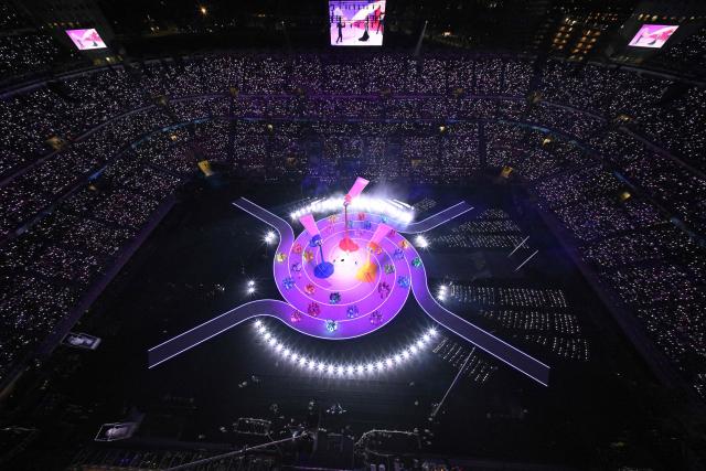 Dancers perform during the opening ceremony of the Milano Cortina 2026 Winter Olympic Games at the San Siro stadium in Milan, northern Italy, on February 6, 2026. (Photo by Antonin THUILLIER / AFP)