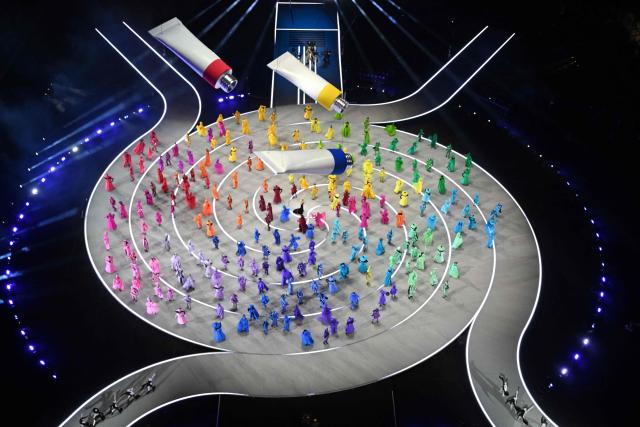 Dancers perform during the opening ceremony of the Milano Cortina 2026 Winter Olympic Games at the San Siro stadium in Milan, northern Italy, on February 6, 2026. (Photo by Antonin THUILLIER / AFP)