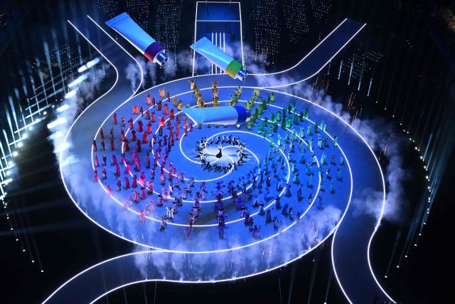 Dancers perform during the opening ceremony of the Milano Cortina 2026 Winter Olympic Games at the San Siro stadium in Milan, northern Italy, on February 6, 2026. (Photo by Antonin THUILLIER / AFP)