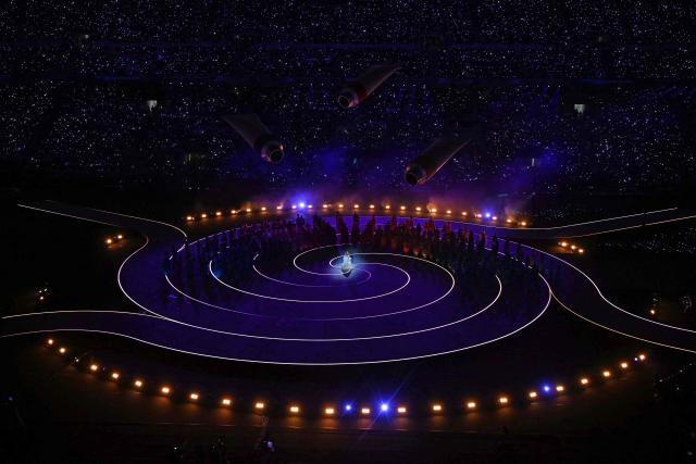 US singer Mariah Carey performs during the opening ceremony of the Milano Cortina 2026 Winter Olympic Games at the San Siro stadium in Milan, northern Italy, on February 6, 2026. (Photo by Gabriel BOUYS / AFP)