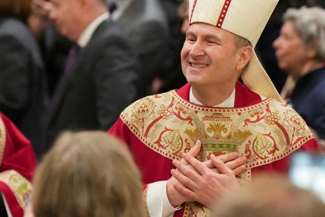 New York Archbishop-designate Ronald A. Hicks, who is taking over from Cardinal Timothy Dolan, who has held the post since 2009, greets the faithful as he attends his installation Mass at St. Patrick's Cathedral in Manhattan in New York, on February 6, 2026. (Photo by Angelina Katsanis / POOL / AFP)