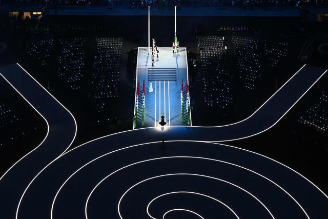 Italian singer Laura Pausini sings the Italian anthem during the opening ceremony of the Milano Cortina 2026 Winter Olympic Games at the San Siro stadium in Milan, northern Italy, on February 6, 2026. (Photo by Antonin THUILLIER / AFP)