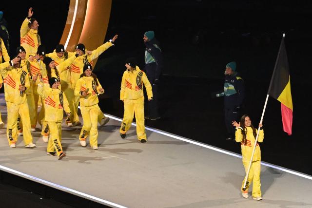 Belgium's flag bearer Hanne Desmet parades with other atheletes during the opening ceremony of the Milano Cortina 2026 Winter Olympic Games at the San Siro stadium in Milan, northern Italy, on February 6, 2026. (Photo by Piero CRUCIATTI / AFP)