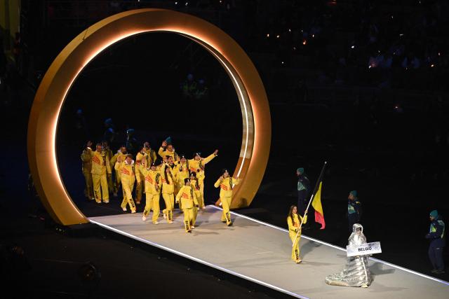 Belgium's flag bearer Hanne Desmet parades with other atheletes during the opening ceremony of the Milano Cortina 2026 Winter Olympic Games at the San Siro stadium in Milan, northern Italy, on February 6, 2026. (Photo by Piero CRUCIATTI / AFP)