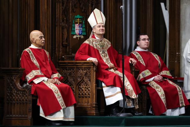 Ronald Hicks (C) is installed as the 11th Archbishop of New York during an installation Mass at St. Patrick’s Cathedral, succeeding Cardinal Timothy Dolan in New York on February 6, 2026. (Photo by ANGELA WEISS / AFP)