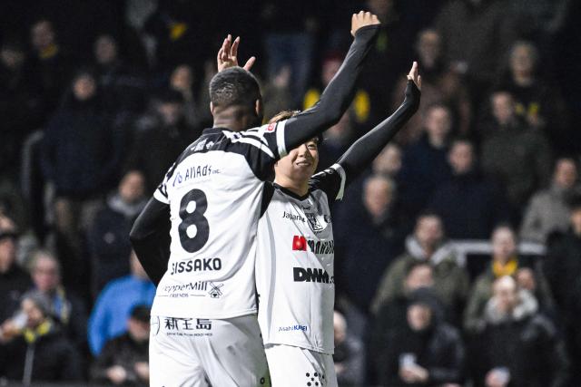 STVV's Japanese midfielder #06 Rihito Yamamoto (R) celebrates after scoring a goal during the Belgian "Pro League" First Division football match between KVC Westerlo and Sint-Truidense Voetbalvereniging (STVV) at Het Kuipje in Westerlo on February 6, 2026. (Photo by Tom Goyvaerts / BELGA / AFP) / Belgium OUT