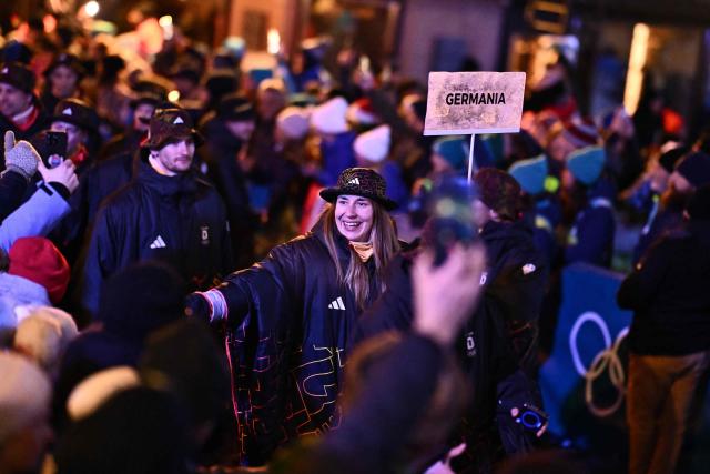 Germany's Jacqueline Pfeifer parades with her country's delegation during the opening ceremony of the Milano Cortina 2026 Winter Olympic Games in Cortina d'Ampezzo, northern Italy, on February 6, 2026. (Photo by Marco BERTORELLO / AFP)
