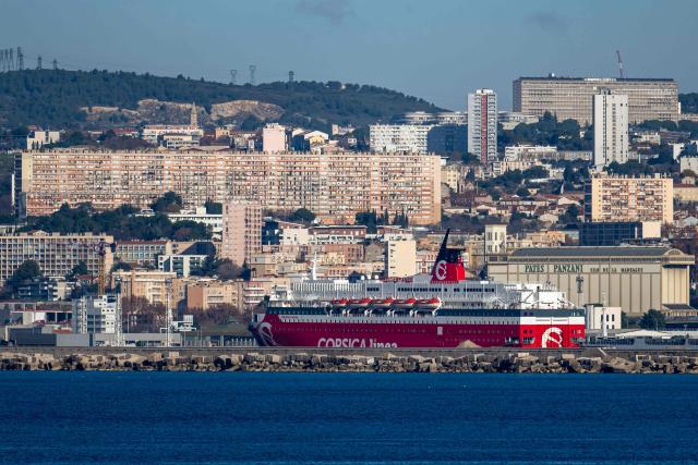 (FILES) This photograph taken on December 18, 2025 shows a ship belonging to the shipping company "Corsica Linea" moored in the port of Marseille, southern France. On February 6, 2026 evening, the ferry company Corsica Linea told AFP it was resuming traffic for its ships after an agreement that put an end to a strike by unions defending sailors’ working conditions. (Photo by MIGUEL MEDINA / AFP)